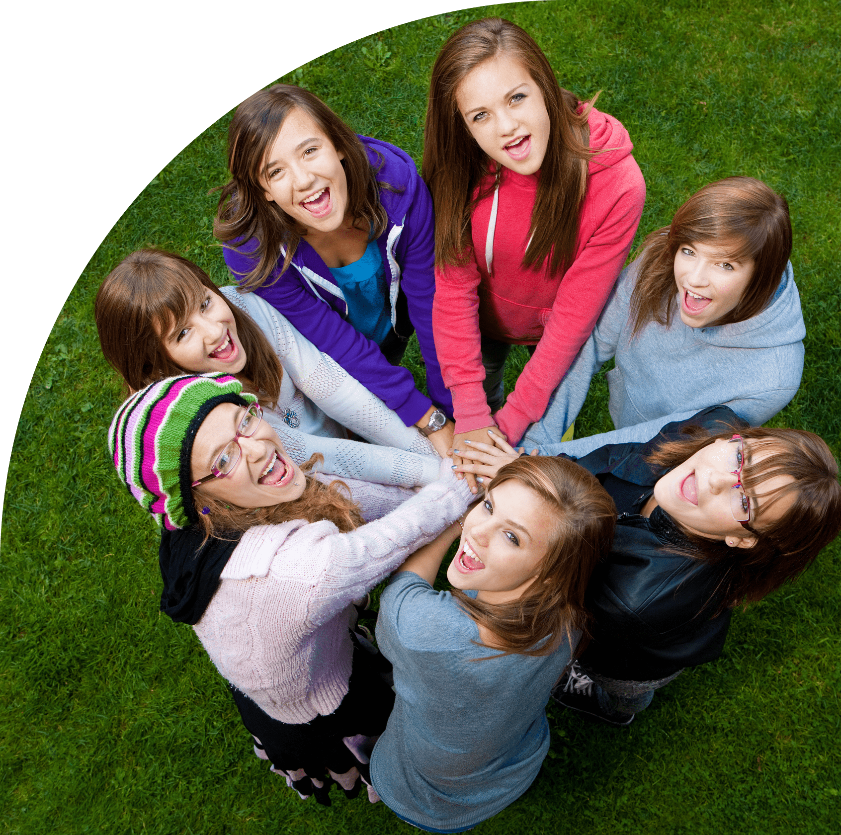 Group of smiling friends in a circle.